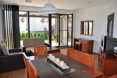 a living room with a couch and a table at Villa on the Black Sea in Sunny Beach