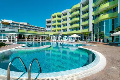 a large swimming pool in front of a building at MPM Hotel Arsena - Ultra All Inclusive in Nesebar