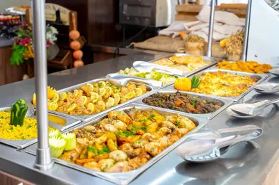 a buffet line with many different types of food at MPM Hotel Arsena - Ultra All Inclusive in Nesebar