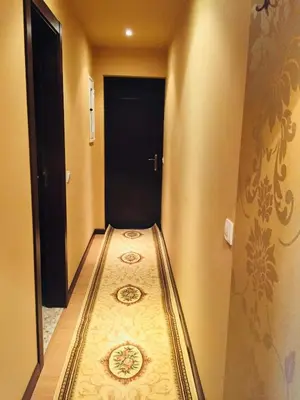 a hallway with a long aisle in a room at Barcelo SeaView Apartment in Sunny Beach