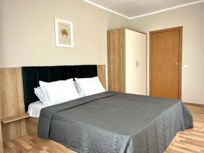 a bedroom with a large bed with white pillows at Sineva Del Sol Apartments in Sveti Vlas