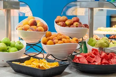 a display of bowls of fruit on a table at MPM Hotel Orel - Ultra All Inclusive in Sunny Beach