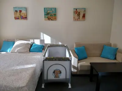 a room with a bed and a couch and a table at Relax studio by the sea, Bulgaria,Nesebar,Aheloy in Aheloy