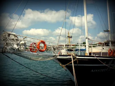 a boat is docked in the water with at Relax studio by the sea, Bulgaria,Nesebar,Aheloy in Aheloy