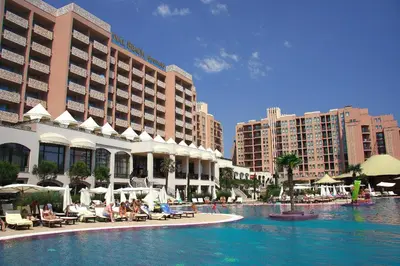 a resort with a swimming pool in front of buildings at Royal Beach Apartments in Sunny Beach