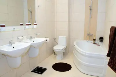 a bathroom with a toilet and a sink and a tub at Sea Dream Rental Apartments in Varna City