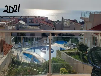 a view of a swimming pool from a balcony at Fantastic Sea View Sun village Byala in Byala