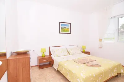 a bedroom with a bed with a bowl on it at BulgariaVilla - Villa Knox in Bryastovets