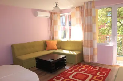 a living room with a couch and a window at CITY STAY in Varna in Varna City