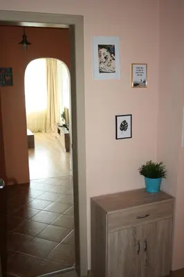 a hallway with a door leading to a living room at Apartments Del Sol - Sunny Island Complex in Chernomorets