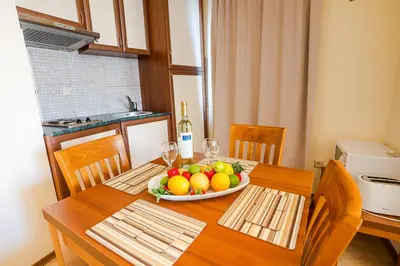 a table with a bowl of fruit on it at TSB Sunny Victory in Sunny Beach