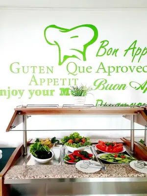 a sign that says bon appetite our improved appetite to enjoy your meal at Peter Hotel in Ravda
