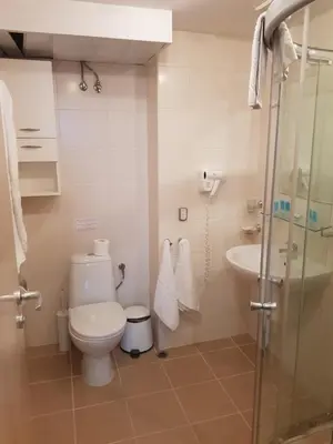 a bathroom with a toilet and a sink at Apartment with Sea View in Obzor Beach in Obzor