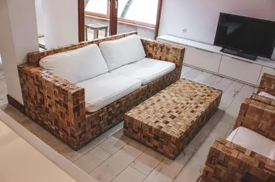 a living room with a couch and a tv at Family Hotel Casa del Mare in Sozopol