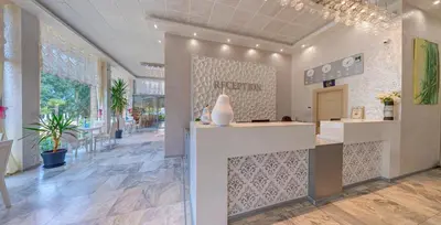 a lobby of a store with a vase on a counter at Kamenec Hotel in Nesebar