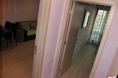 an open door to a room with a living room at Paradise Day in Pomorie
