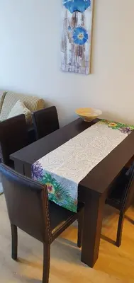 a dining room table with a table and chairs at апартамент CACAO RESIDENCE in Sunny Beach
