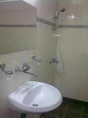 a bathroom with a sink and a shower at Hotel Yantra in Sunny Beach