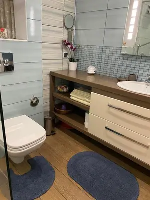 a bathroom with a toilet and a sink at Apartment Nadejda in Pomorie