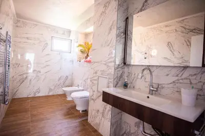 a bathroom with a sink and a toilet in it at Villa Lili in Sozopol