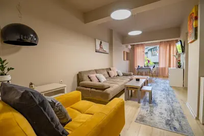 a living room with a couch and a table at City Center apartament “MARTA” in Varna City