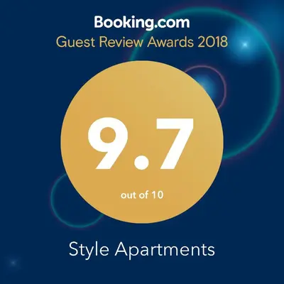 a sign that says guest review awards with a yellow circle at Style Apartment in Pomorie