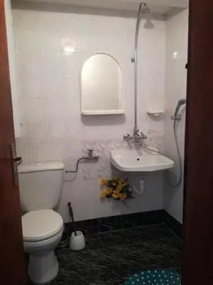 a bathroom with a toilet and a sink at Apartment Marchela in Nesebar