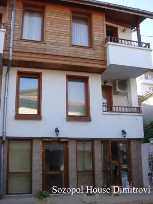 a large house with windows and a balcony at Sozopol House Dimitrovi in Sozopol