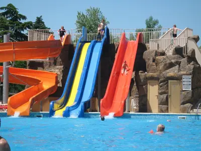 a group of slides in the water at a water park at Hotel Iskar & Aquapark - All Inclusive in Sunny Beach