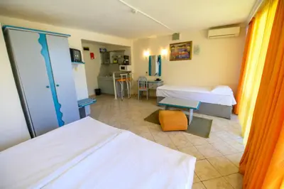 a hospital room with two beds and a kitchen at Hotel Iskar & Aquapark - All Inclusive in Sunny Beach