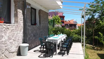 a table and chairs sitting on a patio at Villa Burkopolis in Sozopol
