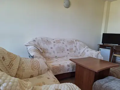 a living room with a couch and a table at Hotel Elica in Varna City