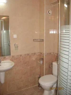 a bathroom with a toilet and a sink at Hotel Elica in Varna City