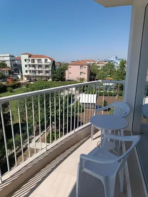 a balcony with a table and a chair and a view at Къща Веси VeSea in Nesebar