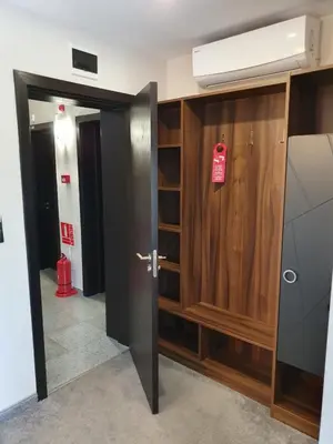 a room with a door with a sign on it at Family Hotel Novel City in Burgas City