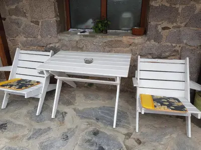 a white table and two chairs and a table and two chairs at Guest House Antique in Sozopol