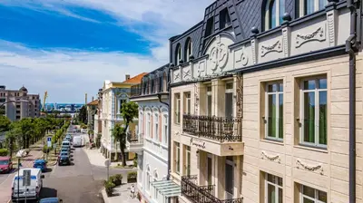 a view of a city street with buildings at Hotel Residence Promenade in Burgas City