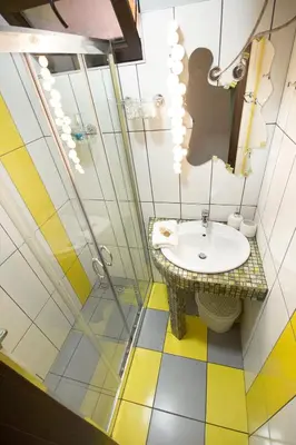 a bathroom with a sink and a shower at Dreamcatcher's home by RV Apartments in Varna City