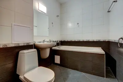a bathroom with a toilet and a tub and a sink at ДриймБг Апартаменти - Райска Градина, Свети Влас in Sveti Vlas