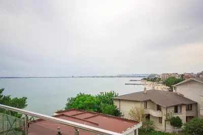 a view of a large body of water with buildings at Villa Tuna in Sveti Vlas