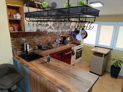 a kitchen with a wooden counter top in a room at Arte Casa in Burgas City