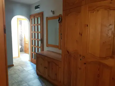 a room with a wooden wall with a mirror at Одеса 37 in Sozopol