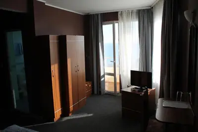 a hotel room with a view of the ocean at Family Hotel Lazuren Briag in Burgas City