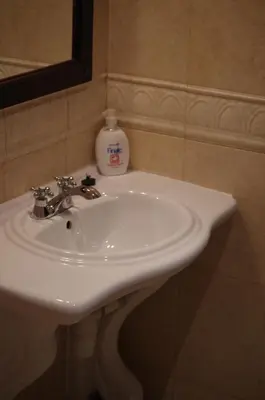 a white sink in a bathroom with a mirror at Beautiful 1st-Line Seaview Private Appartement in The Cliff resort in Obzor