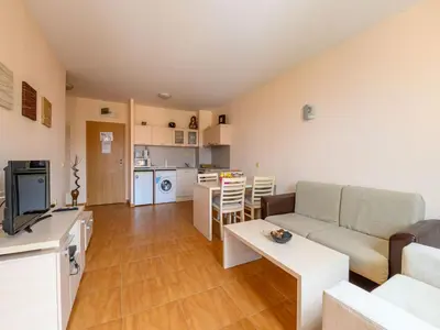 a living room with a couch and a table at Apartcomplex Panorama Dreams in Sveti Vlas