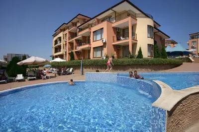 a swimming pool in front of a building at Apartcomplex Panorama Dreams in Sveti Vlas