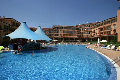 a large swimming pool with people in a resort at Apartcomplex Panorama Dreams in Sveti Vlas