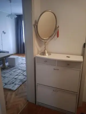 a dressing room with a mirror on a dresser at Sweet Home in Burgas City