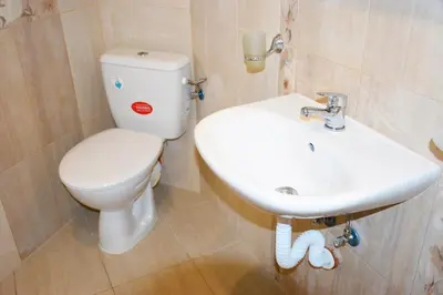 a bathroom with a toilet and a sink at studio ASI in Obzor