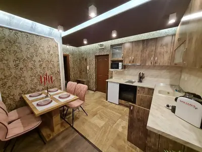 a kitchen with a table and chairs and a sink at MitProt Panorama Bay 2 luks Apartment ap100 in Sveti Vlas